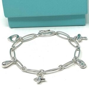 Authentic Tiffany & CO. Elsa Peretti Five mini Charm Bracelet.